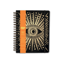 An undated planner with a black cover featuring a gold eye design and a matte gold wire binding.